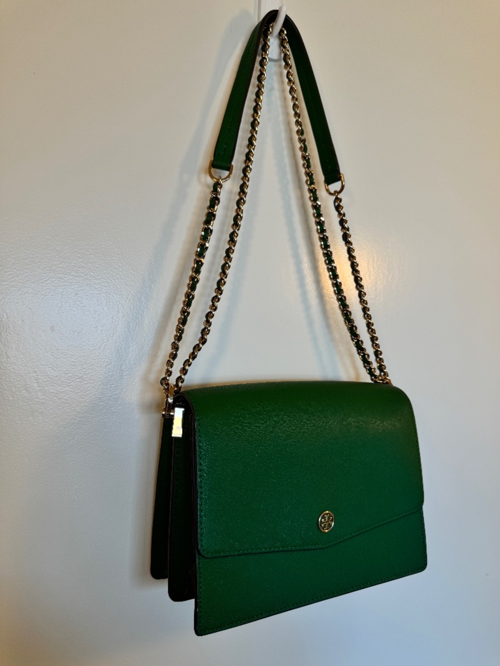 Emerald green Tory Burch purse with painted daisies